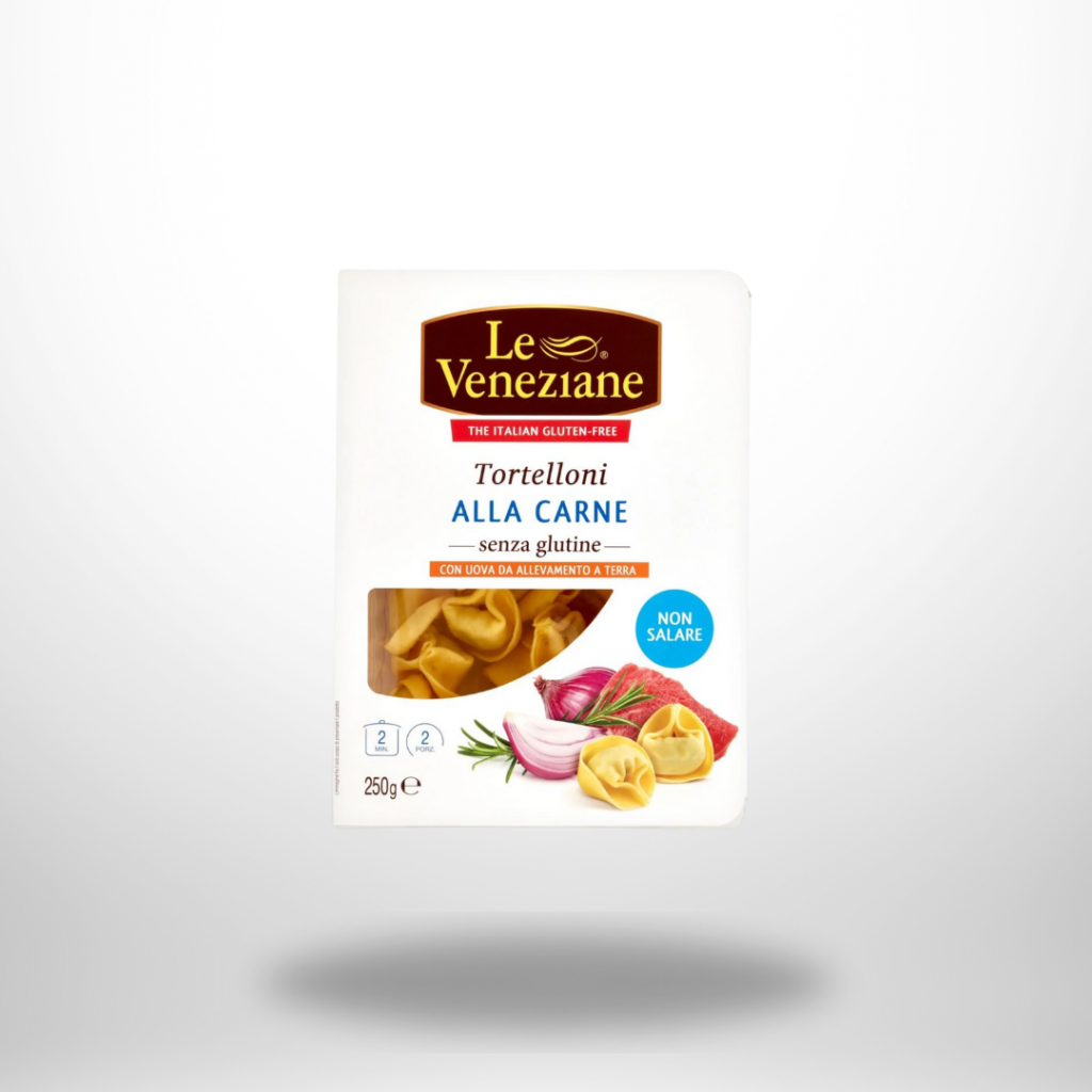 Packung Le Veneziane Tortelloni alla Carne (glutenfrei, 250 g) mit Sichtfenster auf gelbe Tortelloni-Ringe und rot-goldenem Label.