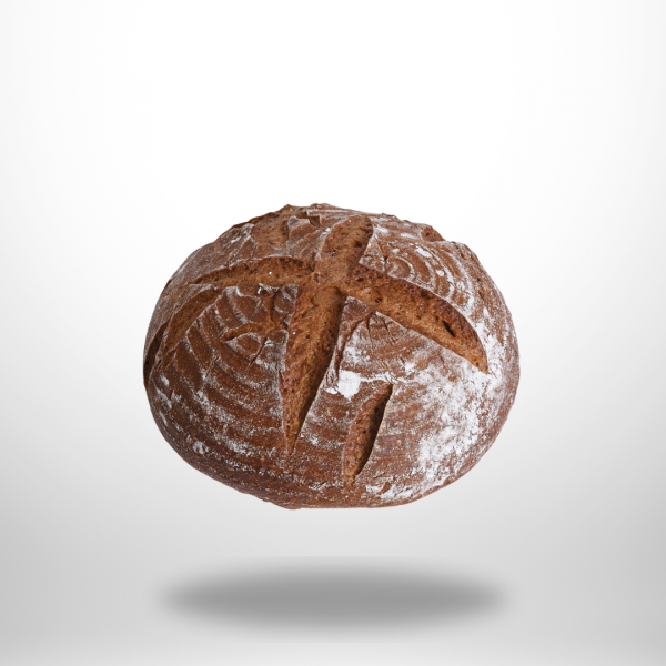 Goldbrauner glutenfreier Gewürzlaib (500 g) mit rustikaler Kruste; Kümmel- und Koriandersamen sichtbar.