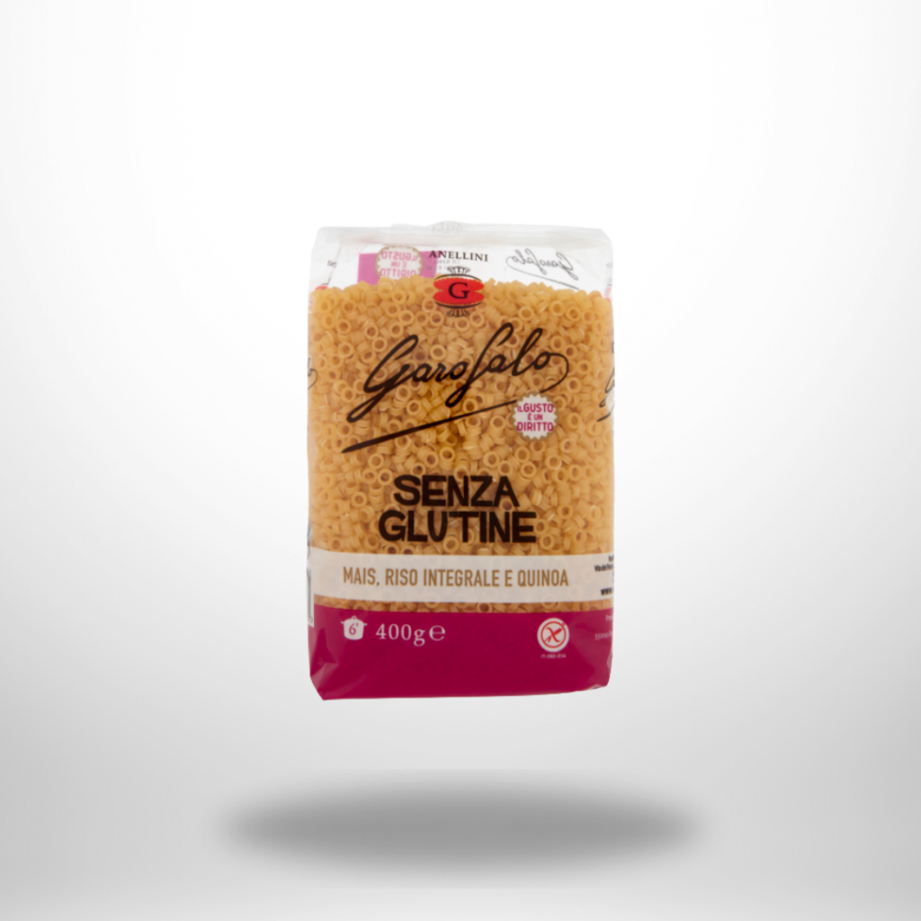 Das Bild zeigt eine 400 g Packung Garofalo Anellini Glutenfrei. Die Nudeln in Ringform sind durch ein Sichtfenster sichtbar. Die Verpackung ist hell und trägt den Hinweis „Senza Glutine“. Ringnudeln mit rauer Oberfläche – ideal für Suppen, Eintöpfe und Aufläufe, ansprechend in Szene gesetzt.