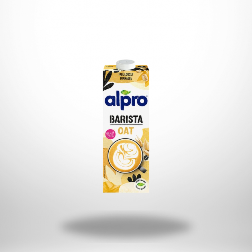 Karton „Alpro Barista – Gluten Free Oat“ mit Latte-Art-Tasse; weiß-gelbes Swirl-Design.
