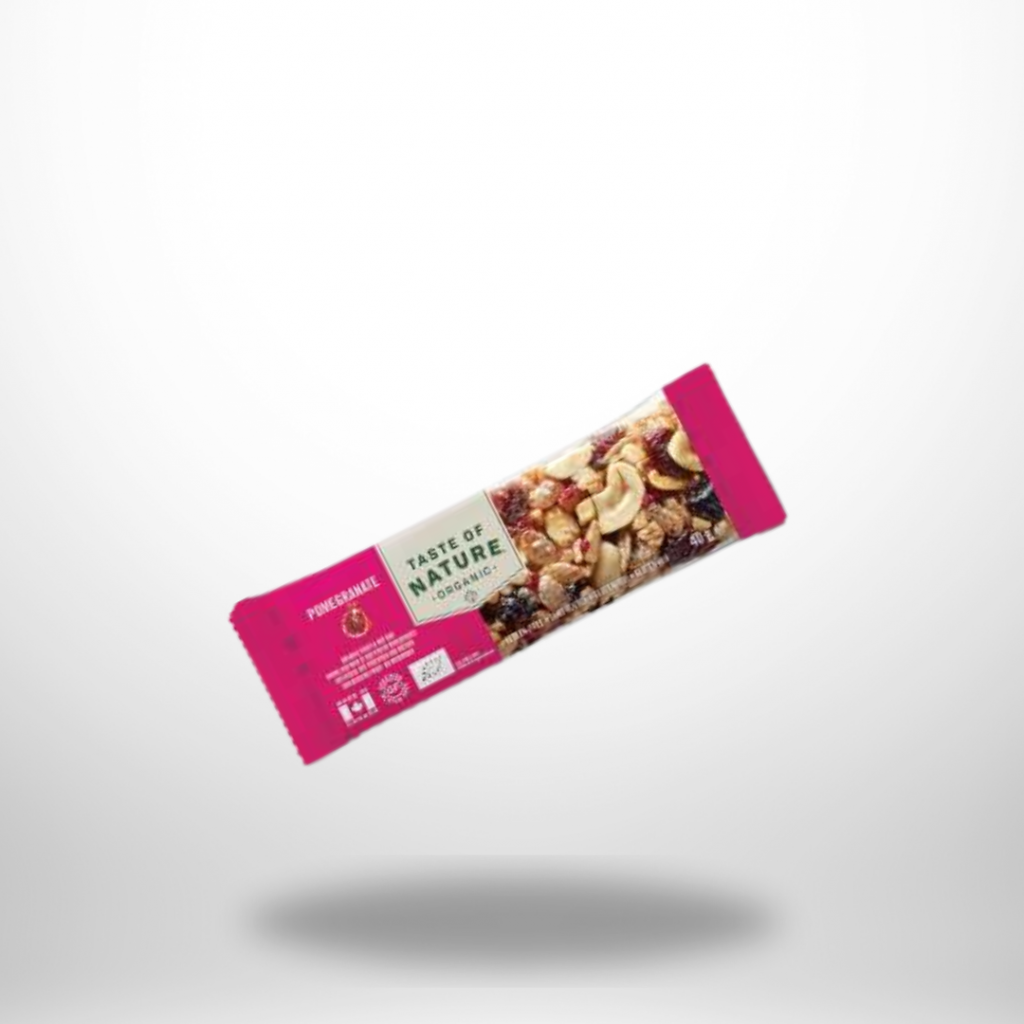 Pink verpackter Riegel mit Sichtfenster auf Nuss-Mischung; Aufdruck „Taste of Nature Organic – Pomegranate“.