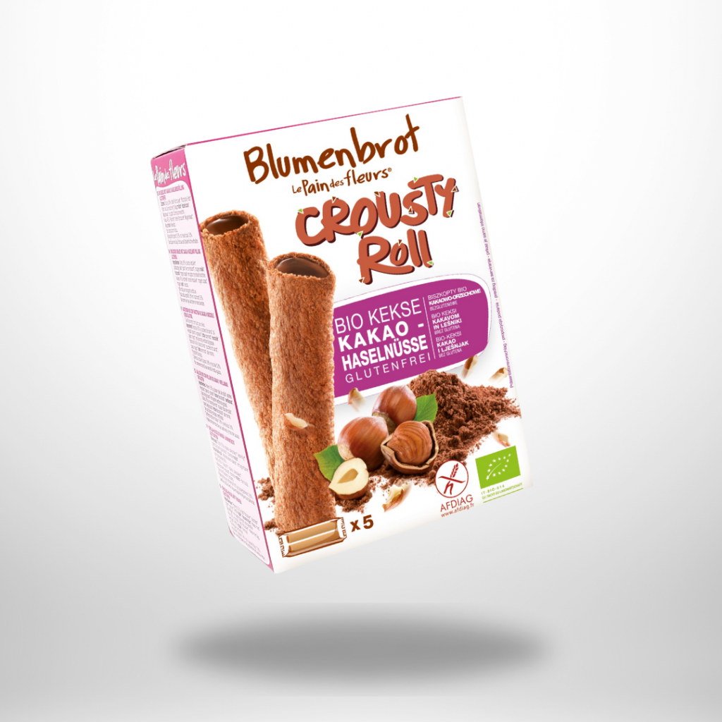 Weiße 125-g-Packung „Blumenbrot Crousty Roll Kakao-Haselnüsse“ mit zwei hohlen Biskuitröllchen, Haselnüssen & Kakaopulver.