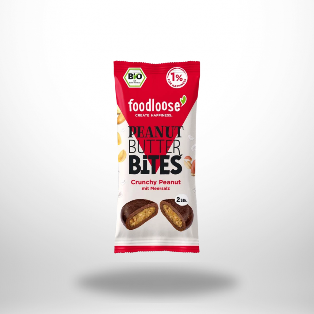 foodloose Peanut Butter Bites Crunchy Peanut – Einzelpackung mit aufgeplatzen Bite, sichtbarer Erdnussfüllung & ganzen Erdnüssen.