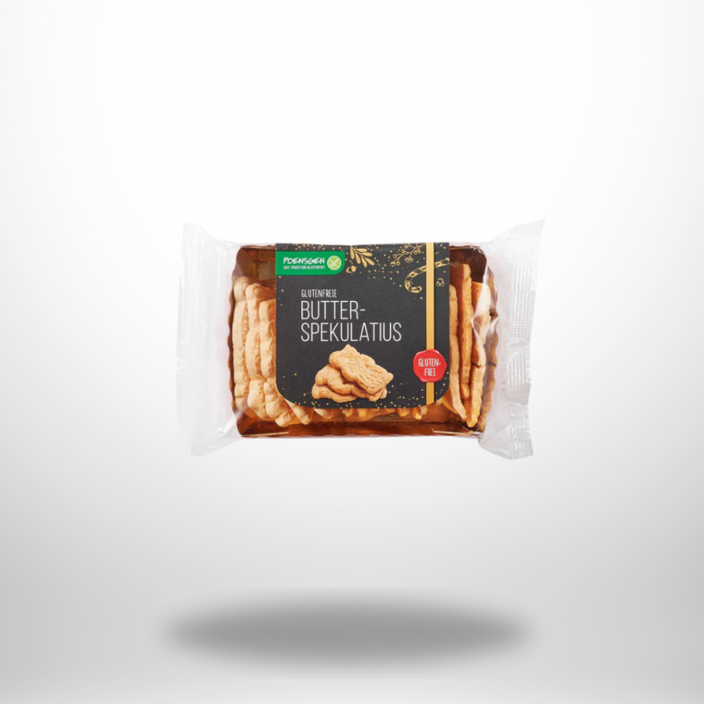 Drei mit Schokolade überzogene Spekulatius-Kekse neben der Produktverpackung
